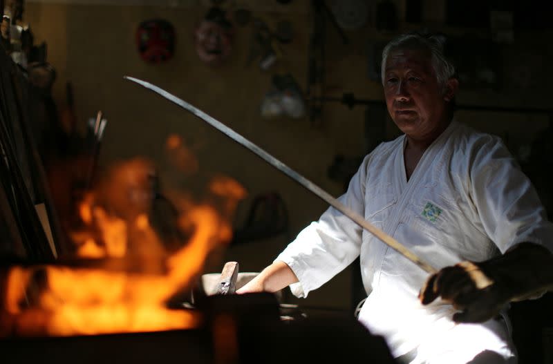 Samurai Suemitsu prepares a katana sword at his home in Curitiba