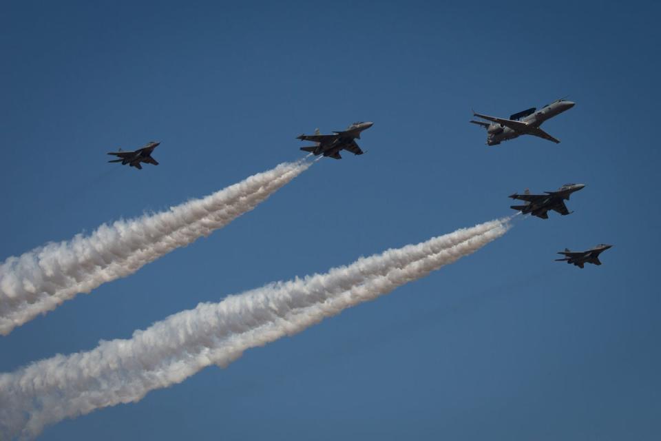Indian Air Force planes fly in formation during the inauguration of the Aero India 2023 at the Yelahanka Air Force Station in Bengaluru, India (Getty Images)