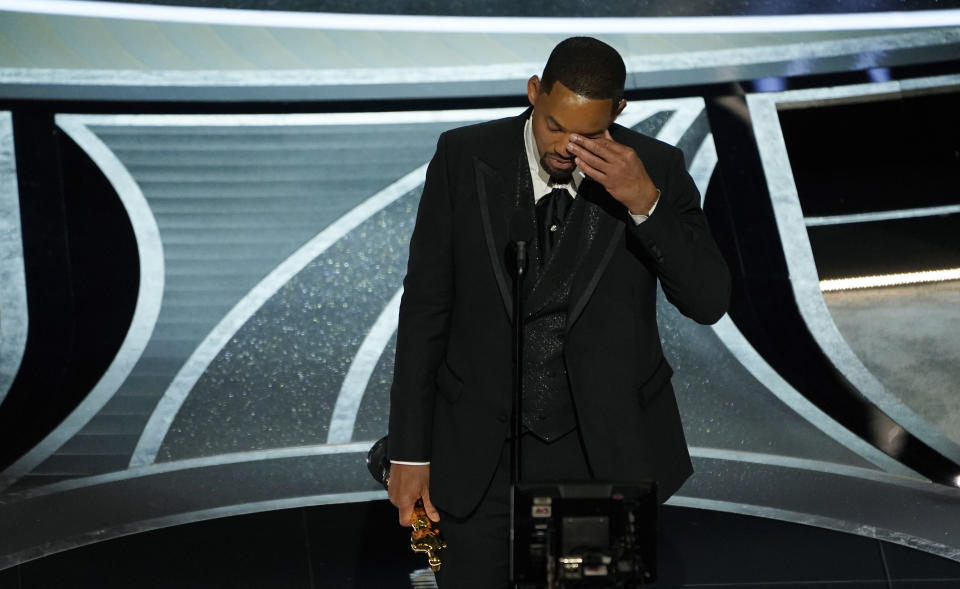 Will Smith wipes away tears during his acceptance speech for Best Actor at the Oscars, Sunday, March 27, 2022, at the Dolby Theatre in Los Angeles. (AP Photo/Chris Pizzello)