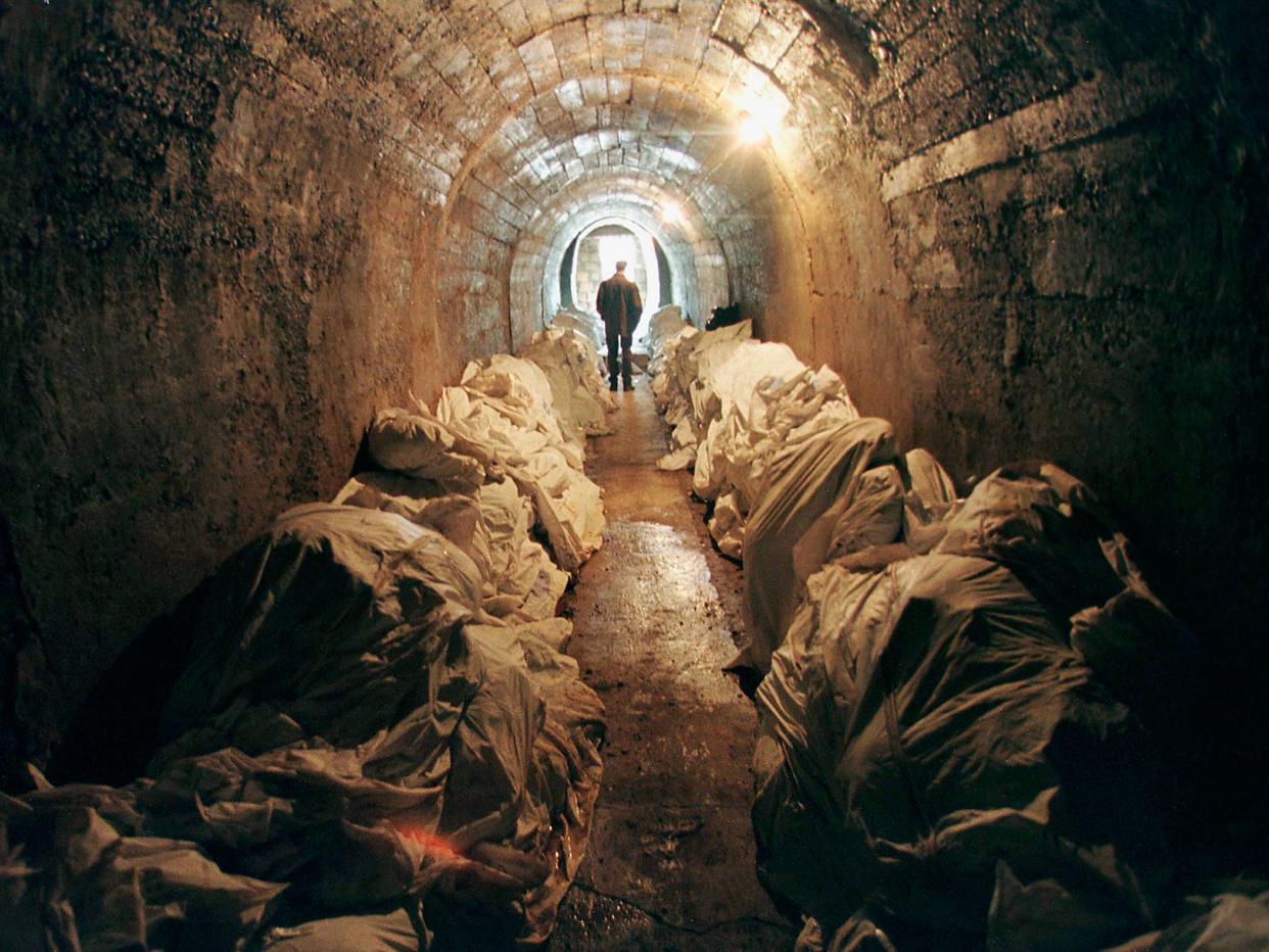 Stacks of unidentified corpses in an underground shelter in Tuzla, Bosnia, in 1997. The body bags contain victims found in mass graves and in wooded areas after the 1995 Srebrenica massacre: Reuters