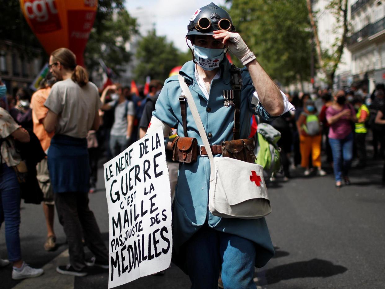 French health workers attend a demonstration on the Bastille Day in Paris to urge the French government to improve wages and invest in public hospital in the wake of the coronavirus: REUTERS/Gonzalo Fuentes