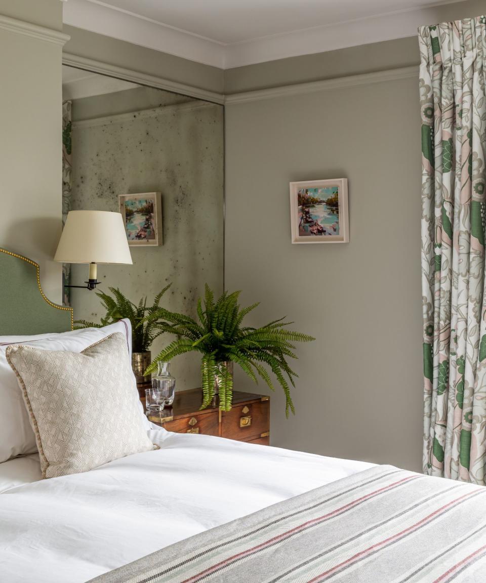 Mirror, wooden table, green headboard