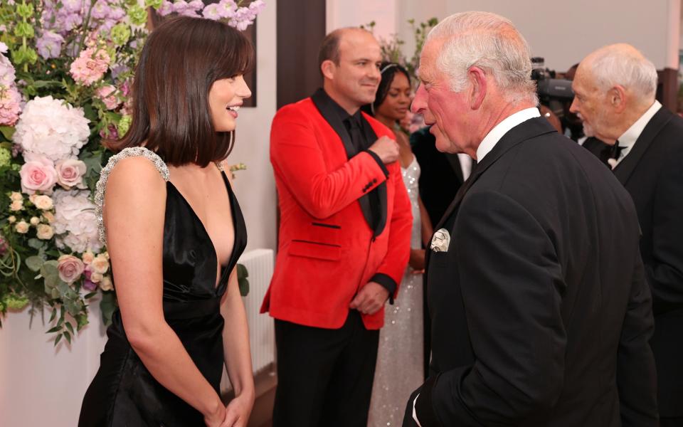 The Prince of Wales meets some of the cast including Ana de Armas at the Royal Albert Hall