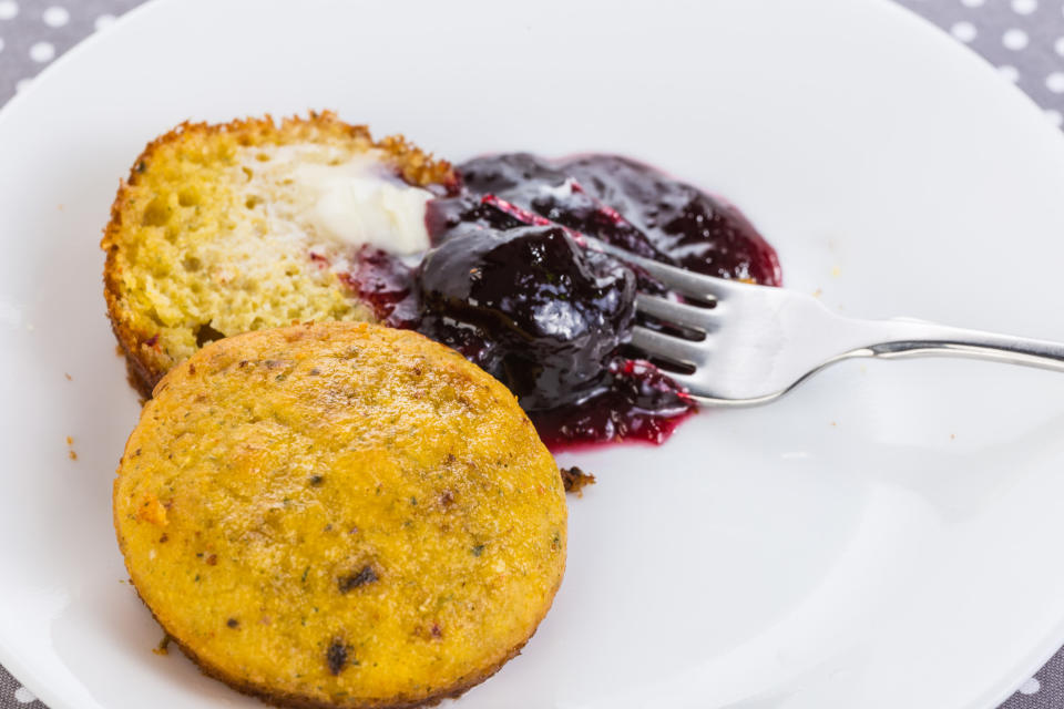 Corn muffins served with jam.