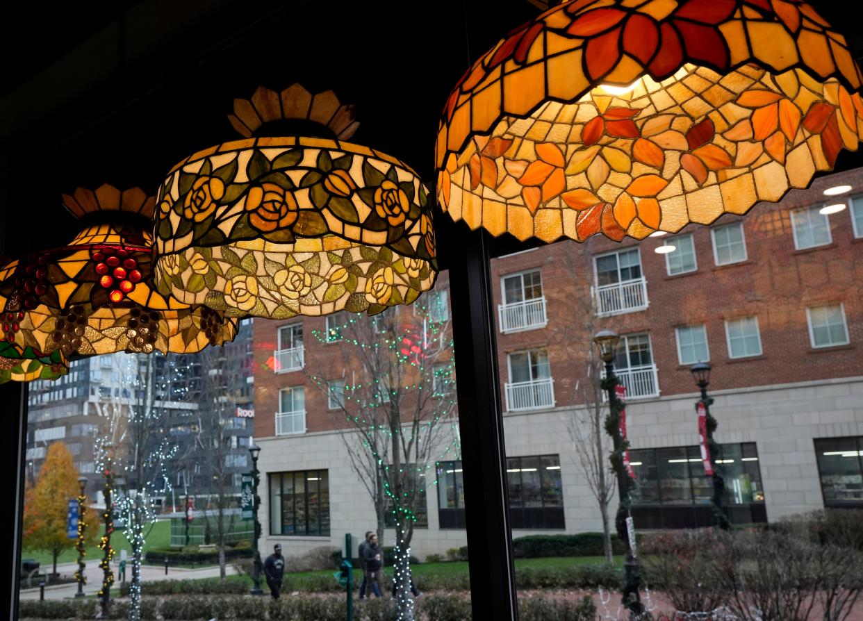 Ornate glass lamps from the original Spaghetti Warehouse in Franklinton hang in the new location at 150 S. High St., Downtown. Spaghetti Warehouse reopened Nov. 30 following a March 2022 roof collapse in its old building.