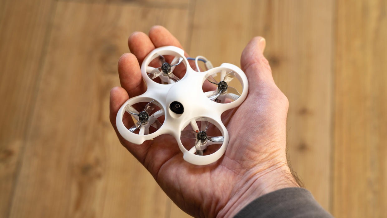  BetaFPV Cetus Lite drone held in a hand. 