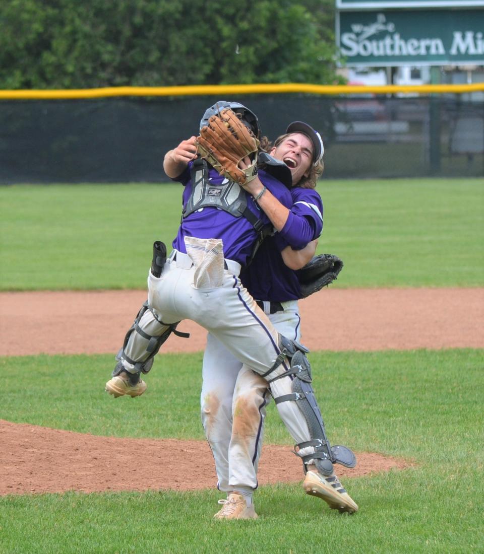 Twin brothers Zach Kucharczyk, left, and relief pitcher Jake Kucharczyk celebrate the final out of Lakeview's 7-5 win over Monroe in June.