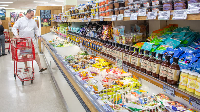 Man walking in frozen food isle at Trader Joe's