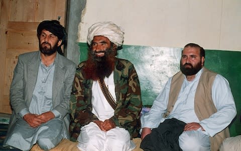 Afghan commander Jalaluddin Haqqani (C) with two top guerilla commanders Amin Wardak and Abdul Haq at his Pakistani base in Miranshah - Credit: AFP