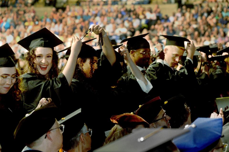 University students move their tassels from the right to the left during the UIS commencement ceremony Saturday, May 13, 2023.