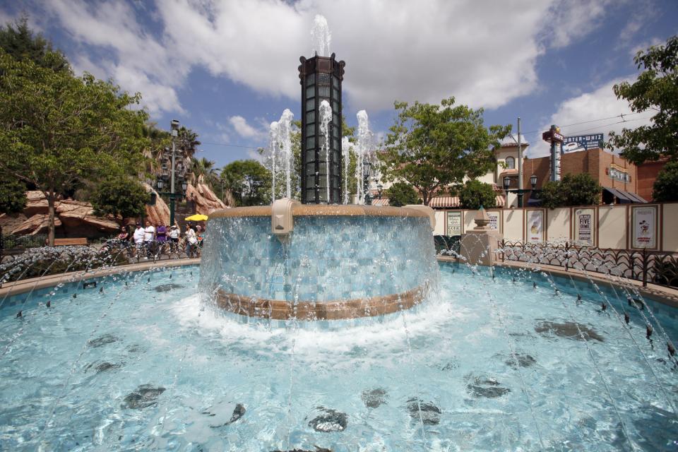 This June 5, 2012 photo shows a fountain at the Buena Vista Street entrance of Disney California Adventure in Anaheim, Calif. The park's five-year, $1 billion-plus revamp has debuted in spurts since 2008. Most of its new features rely on characters that come from Disney's $7.4 billion acquisition of Pixar Animation Studios, the San Francisco-area studio behind "Cars," "Toy Story," "Monsters Inc." and "A Bug's Life." (AP Photo/Nick Ut)