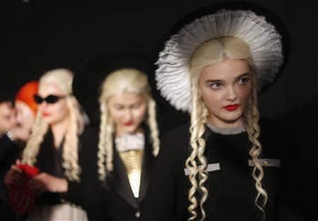 Models line up backstage at the Meadham Kirchhoff Spring/Summer 2014 collection at London Fashion Week September 17, 2013. REUTERS/Olivia Harris