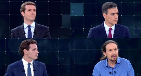 FILE PHOTO: Candidates for Spanish general elections People's Party (PP) Pablo Casado, Spanish Prime Minister and Socialist Workers' Party (PSOE) Pedro Sanchez, Ciudadanos' Albert Rivera and Unidas Podemos' Pablo Iglesias attend a televised debate ahead of general elections in Pozuelo de Alarcon, outside Madrid, Spain, April 22, 2019. TVE via REUTERS/File Photo