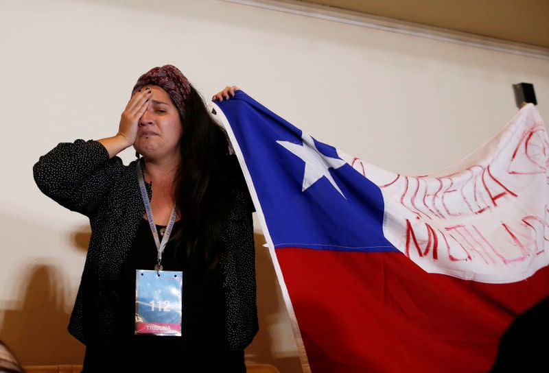A demonstrator opposing the government gestures after the lawmakers rejected a move to impeach President Sebastian Pinera during a session at the congress in Valparaiso