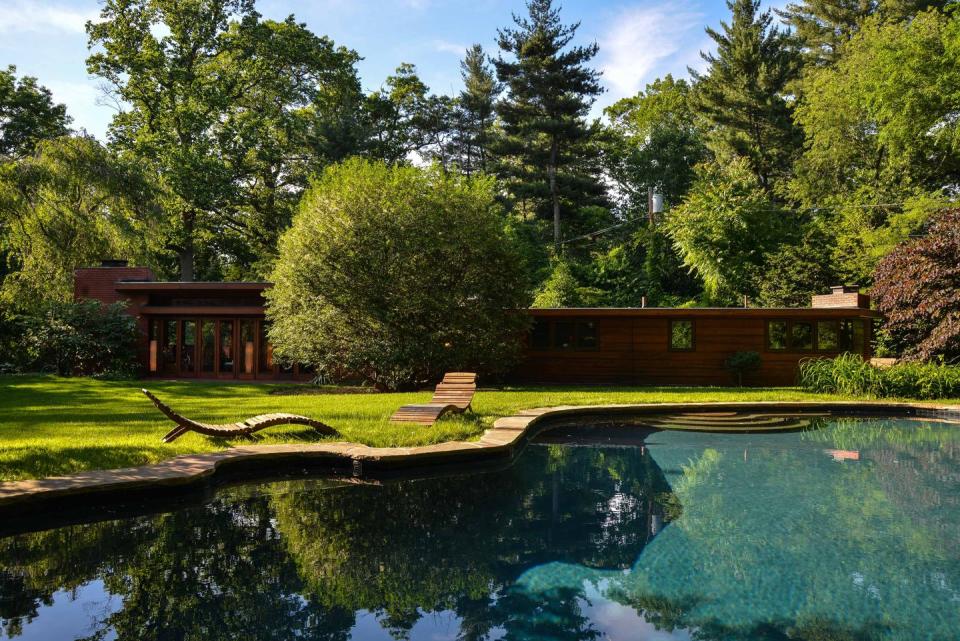 The serene property features a stream as well as a pond. Plus, there's a swimming pool.