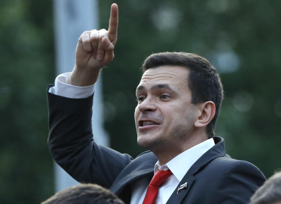 Russian opposition candidate Russian and activist Ilya Yashin gestures while speaking to a crowd during a protest in Moscow, Russia, Monday, July 15, 2019. Opposition candidates who run for seats in the city legislature in September's elections have complained that authorities try to bar them from the race by questioning the validity of signatures of city residents they must collect in order to qualify for the race. (AP Photo/Pavel Golovkin)