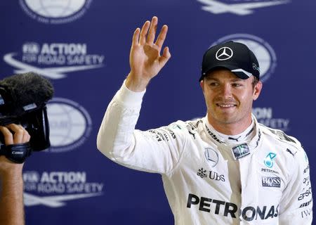 Formula One - Singapore Grand Prix - Marina Bay, Singapore - 17/9/16 Mercedes' driver Nico Rosberg of Germany celebrates pole position after qualifying session. REUTERS/Edgar Su