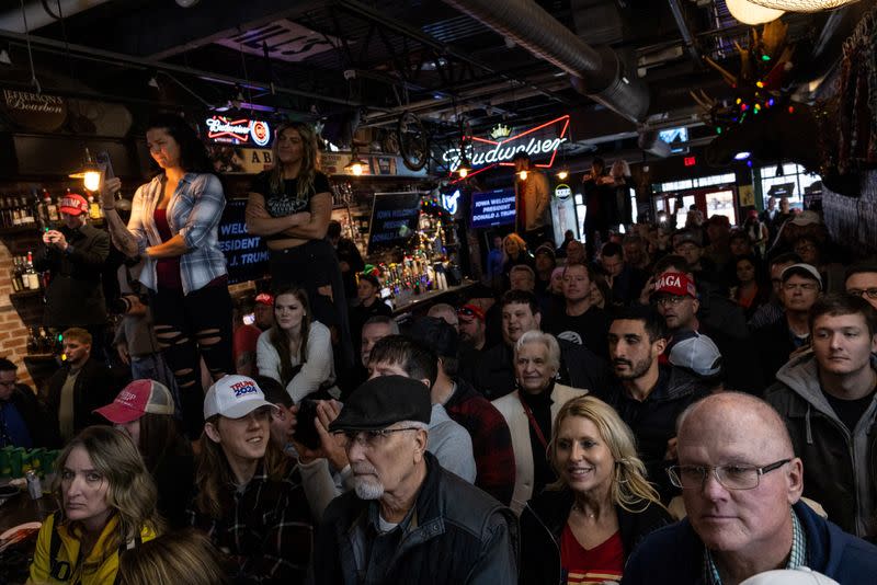 Former U.S. President and Republican presidential candidate Donald Trump attends a "commit to caucus" event, in Ankeny