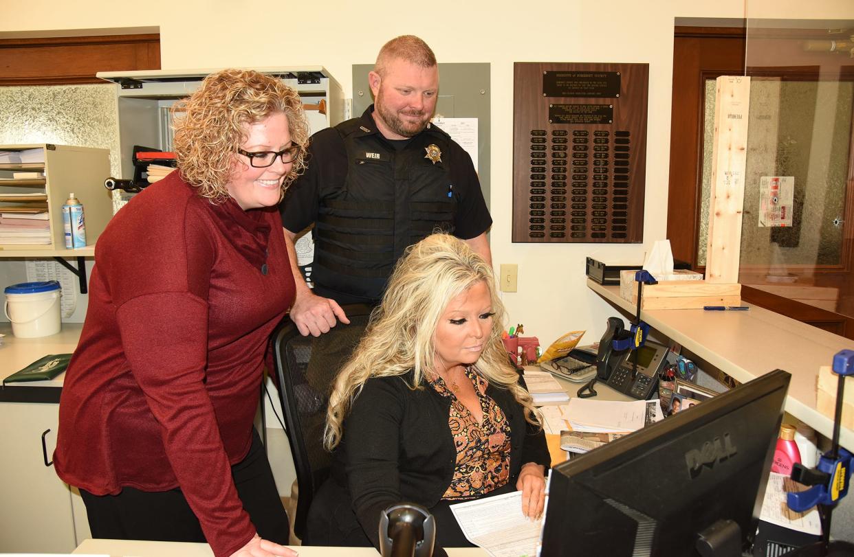Staff of the Somerset County Sheriff's office, office from left, Kami Hearn, Dusty Weir and Missy Truscott, look over the license to carry firearms permit information Jan. 13, 2022, in the Somerset County Courthouse.