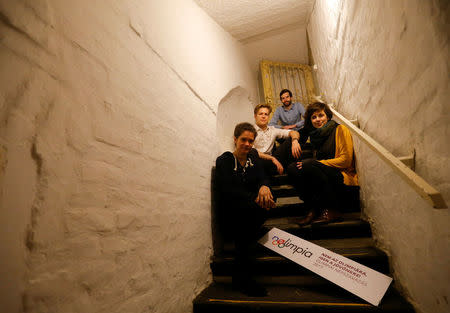 Edina Pottyondy, Miklos Hajnal, Andras Fekete-Gyor and Anna Orosz, leading members of political movement Momentum which challenges Budapest's 2024 Olympic bid with a referendum, stand on the steps leading to Momentum's headquarters, located in a basement in Budapest, Hungary, February 20, 2017. REUTERS/Laszlo Balogh