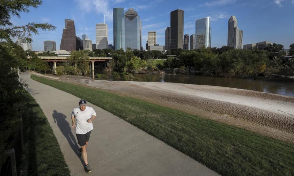 A jogger runs along a trail at Buffalo Bayou Park on 12 September 2017 in Houston.