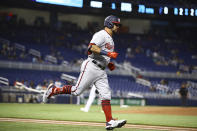 Washington Nationals left fielder Kyle Schwarber (12) rounds first base after hitting a solo home run during the first inning of a baseball game on Thursday, June 24, 2021, in Miami. (AP Photo/Mary Holt)