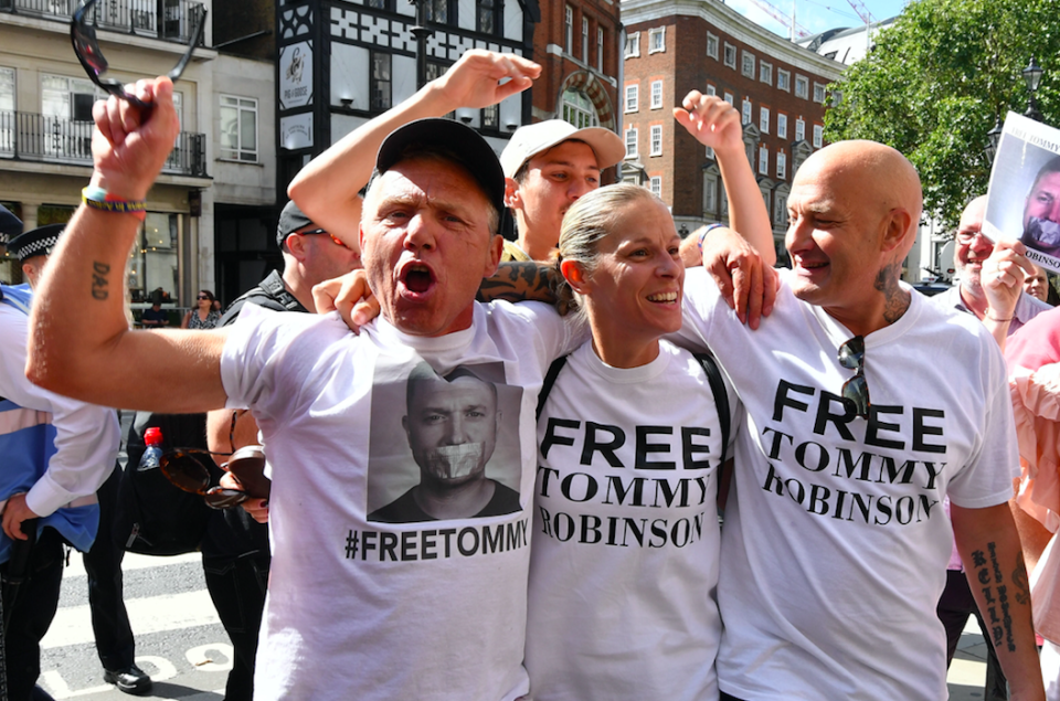 <em>Robinson supporters celebrate after the former EDL leader was freed on bail (PA)</em>