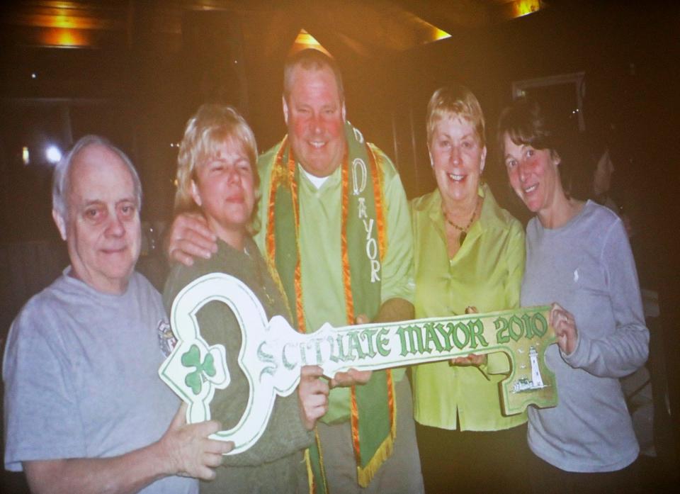 The parade's "Mayor of Scituate," Pat Shea, celebrates winning his "office" in 2010. This year's candidates are Adam Barisamo, Patrice Maye and Cristina Curreri.