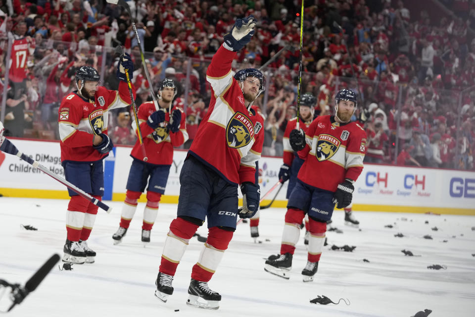 Florida Panthers players acknowledge cheers from the fans at the end of the third period of Game 2 of the NHL hockey Stanley Cup Finals against the Edmonton Oilers, Monday, June 10, 2024, in Sunrise, Fla. (AP Photo/Wilfredo Lee)