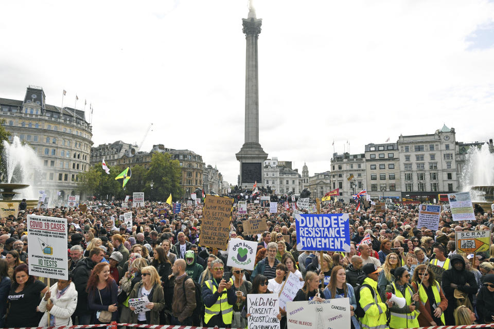 People take part in a 'We Do Not Consent' rally at Trafalgar Square, organised by Stop New Normal, to protest against coronavirus restrictions, in London, Saturday, Sept. 26, 2020. (Stefan Rousseau/PA via AP)