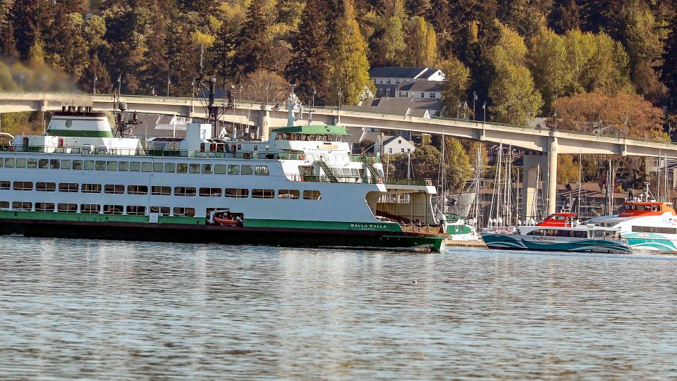 The Washington State Ferry Walla Walla leaves the Bremerton dock as Kitsap Transit’s Reliance heads for their dock in Bremerton on Thursday, April 18, 2024.