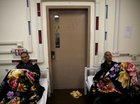 Drug addicts sit on their beds at a newly-opened treatment centre at Camp Phoenix, in Kabul, Afghanistan January 3, 2016. REUTERS/Ahmad Masood