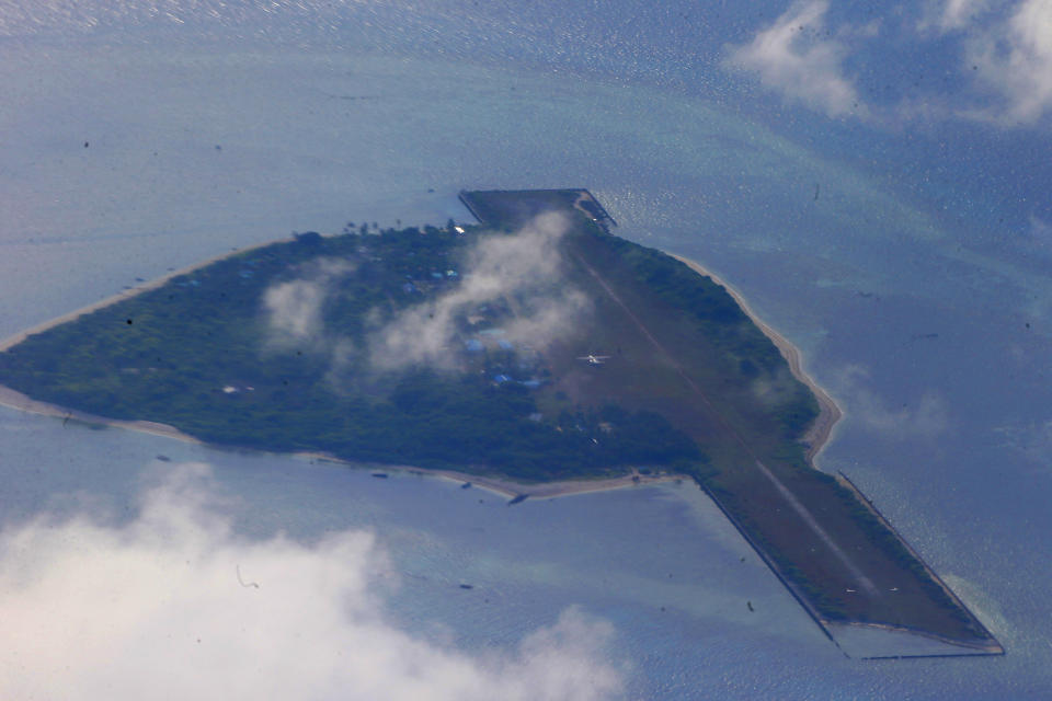 This photo taken from a C-130 transport plane shows Thitu Island off the South China Sea, April 21, 2017. The Philippines has sought an explanation from China after a Filipino military commander reported that the Chinese coast guard forcibly seized Chinese rocket debris in the possession of Filipino navy personnel in the disputed South China Sea, officials said Thursday, Nov. 24, 2022. (AP Photo/Bullit Marquez, File)