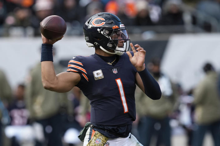 Chicago Bears quarterback Justin Fields (1) throws against the Detroit Lions during the first half of an NFL football game in Chicago, Sunday, Nov. 13, 2022. (AP Photo/Charles Rex Arbogast)