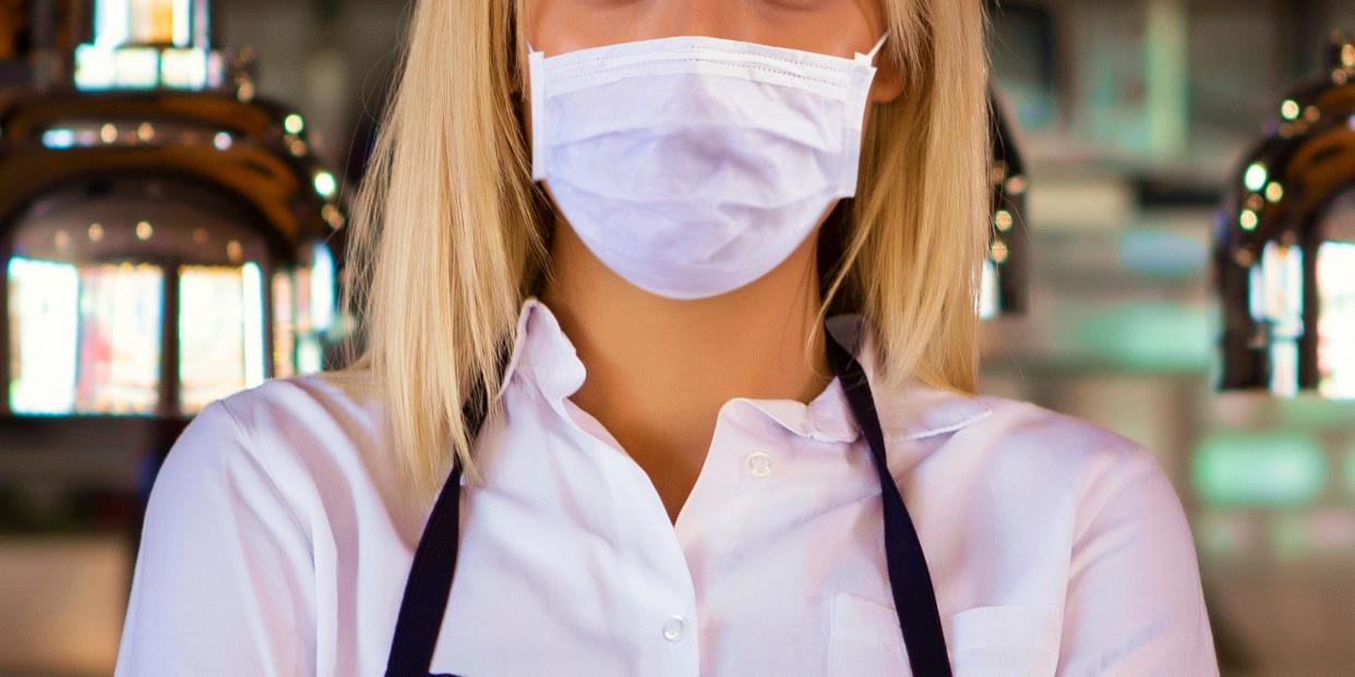 A restaurant worker wearing a mask (file photo).