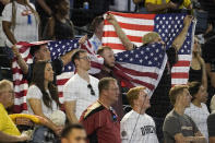 Fans show their respect for the fallen during the Arizona Diamondbacks-Colorado Rockies baseball game, during a moment of silence on Memorial Day, baseball on Monday, May 29, 2023, in Phoenix. (AP Photo/Darryl Webb)