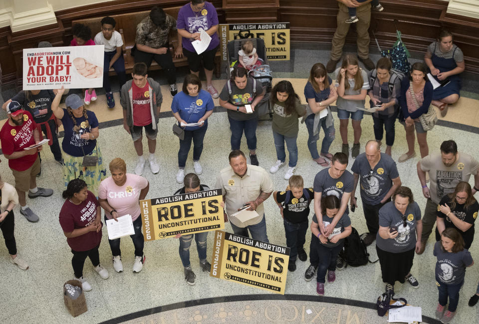 FILE - In this March 30, 2021, file photo, pro-life demonstrators gather in the rotunda at the Capitol while the Senate debated anti-abortion bills in Austin, Texas. Even before a strict abortion ban took effect in Texas this week, clinics in neighboring states were fielding more and more calls from women desperate for options. The Texas law, allowed to stand in a decision Thursday, Sept. 2, 2021 by the U.S. Supreme Court, bans abortions after a fetal heartbeat can be detected, typically around six weeks. (Jay Janner/Austin American-Statesman via AP, File)