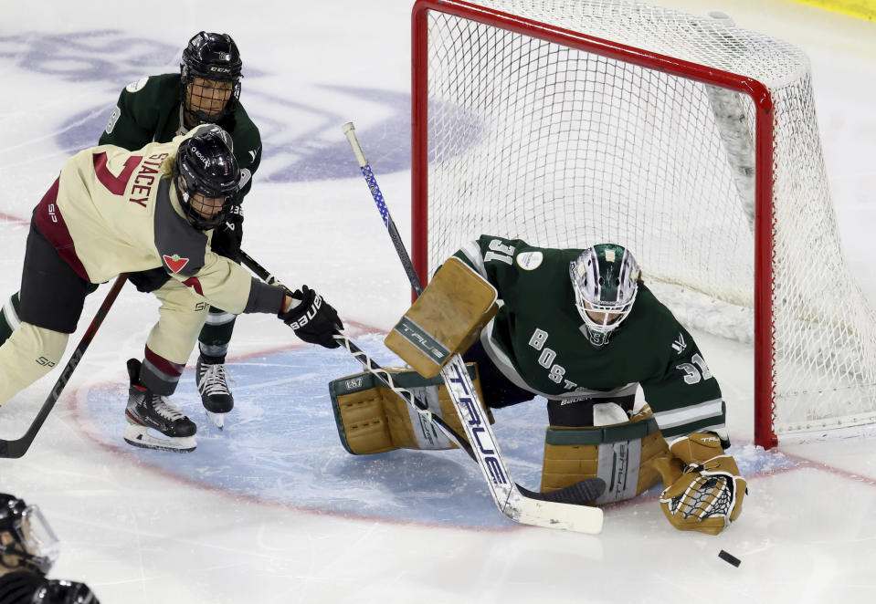 Boston goalie Aerie Frankel (31) makes a save against Montreal forward Laura Stacey (7) during the third period of a PWHL playoff hockey game Tuesday, May 14, 2024, in Lowell, Mass. (AP Photo/Mark Stockwell)