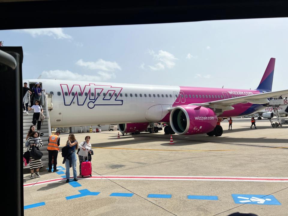 Passengers disembark a Wizz Air Airbus A321neo at Rome Fiumicino Airport.