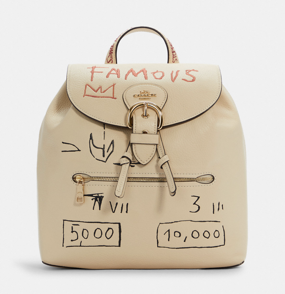 beige Coach x Jean Michel Basquiat Kleo Backpack with famous text and sketches on backpack