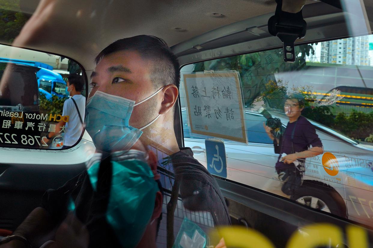 File: Tong Ying-kit arrives at a court in a police van in Hong Kong on 6 July, 2020 (AP)