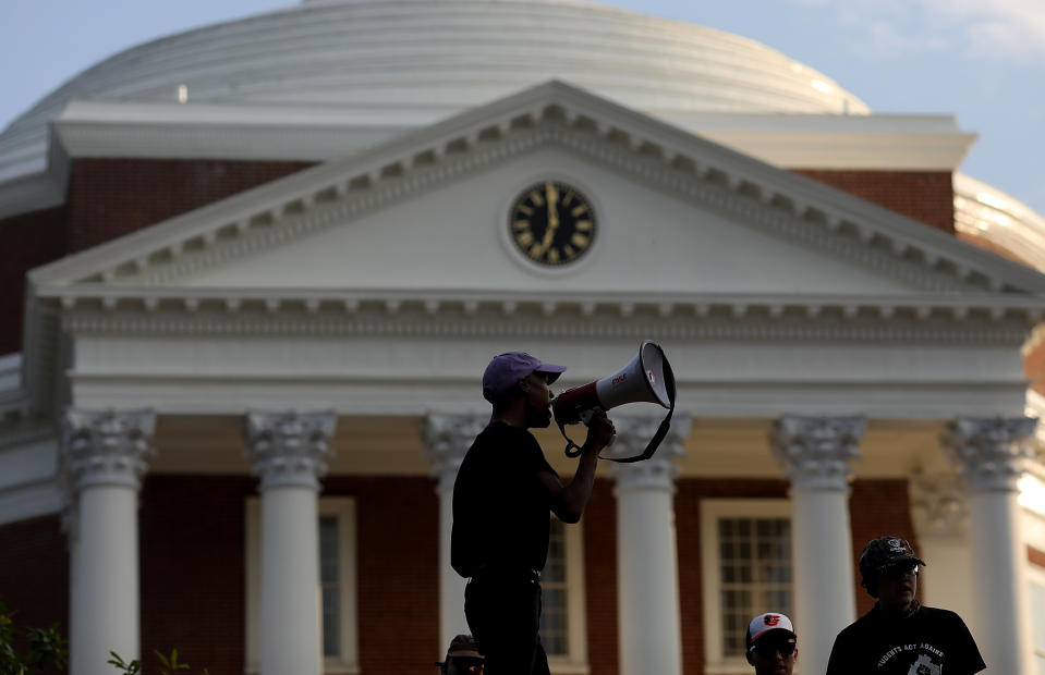 <p>Protesters with the group Students Act Against White Supremacy speak on the campus of the University of Virginia during an event marking the one year anniversary of a deadly clash between white supremacists and counter protesters August 11, 2018 in Charlottesville, Virginia. Charlottesville has been declared in a state of emergency by Virginia Gov. Ralph Northam as the city braces for the one year anniversary of the deadly clash between white supremacist forces and counter protesters over the potential removal of Confederate statues of Robert E. Lee and Stonewall Jackson. A ÃUnite the RightÃ rally featuring some of the same groups is planned for tomorrow in Washington, DC. (Photo: Win McNamee/Getty Images) </p>