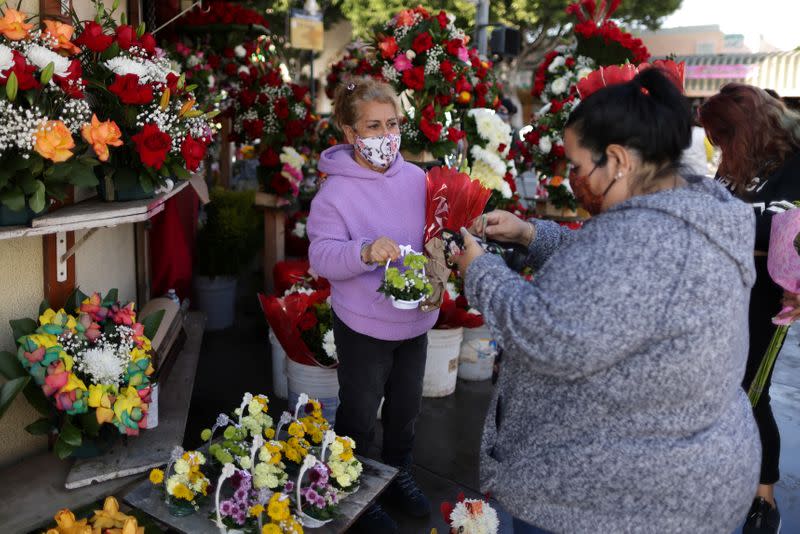 A woman shops at a florist ahead of Valentine's Day in Los Angeles