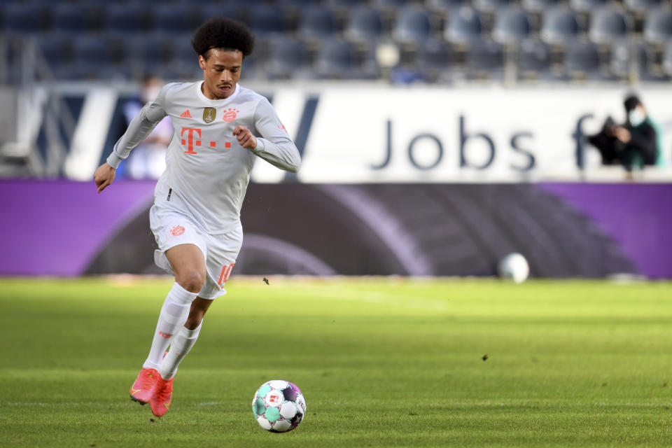 Munich's Leroy Sane controls the ball during the German Bundesliga soccer match between Eintracht Frankfurt and Bayern Munich in Frankfurt, Germany, Saturday, Feb. 20, 2021. (Arne Dedert/POOL via AP)