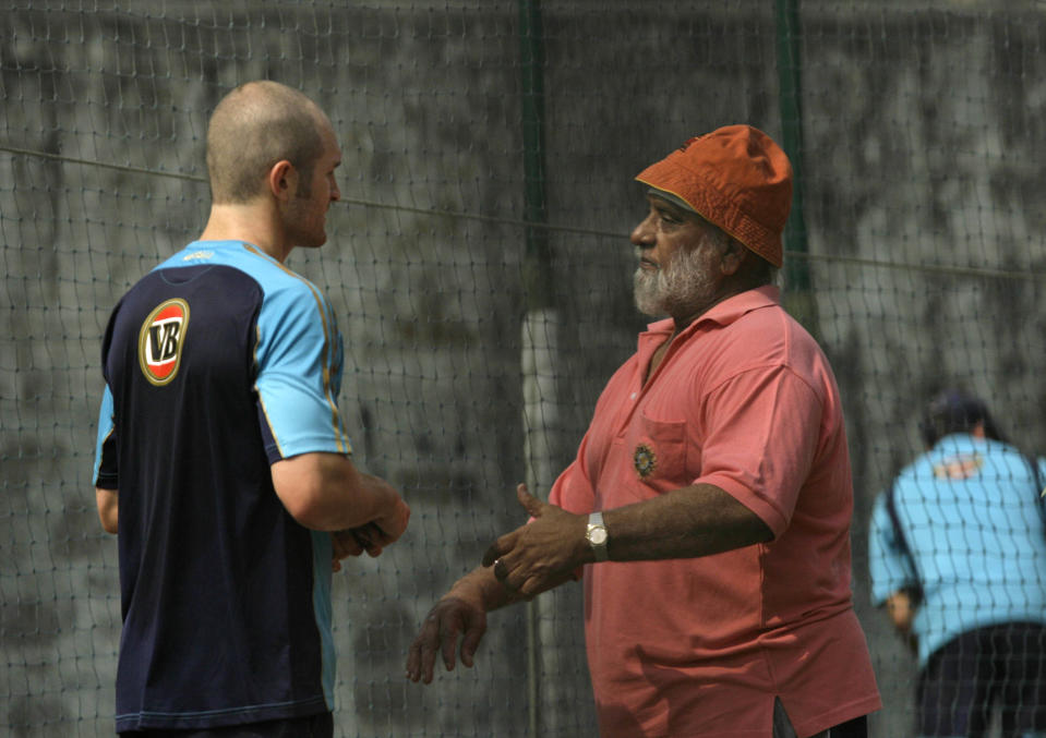 FILE - Australian spinner Jason Krejza, left, talks to former Indian cricketer Bishan Singh Bedi during a practice session in New Delhi, India, on Oct. 26, 2008. Bedi, the India cricket great whose dazzling left-arm spin claimed 266 test wickets, has died. He was 77. The death of Bedi, who underwent multiple surgeries over the last two years that included a knee operation a month ago, was confirmed by the Board of Control for Cricket in India on Monday Oct. 23, 2023. (AP Photo/Manish Swarup, File)