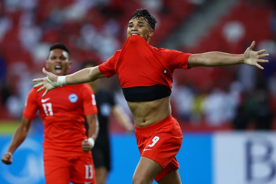 Singapore&#39;s khsan Fandi celebrates after scoring against Indonesia during the first leg of their AFF Suzuki Cup semi-final clash.