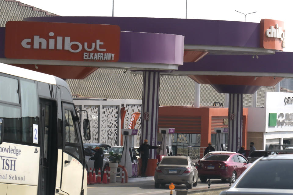 Vehicles wait at Chillout gasoline station, one of the Armed forces owned projects, in Cairo, Egypt, Tuesday, March 21, 2023. Egypt is embarking on a privatization push to help its cash-strapped government, after pressure from the International Monetary Fund. The new policy is supposed to be a serious departure for the Egyptian state, which has long maintained a tight grip over sectors of the economy. (AP Photo)