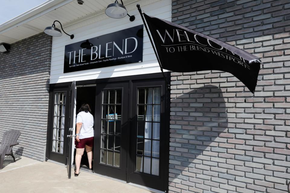 A patron walks into the newly opened The Blend Spa on Route 177 in Westport.