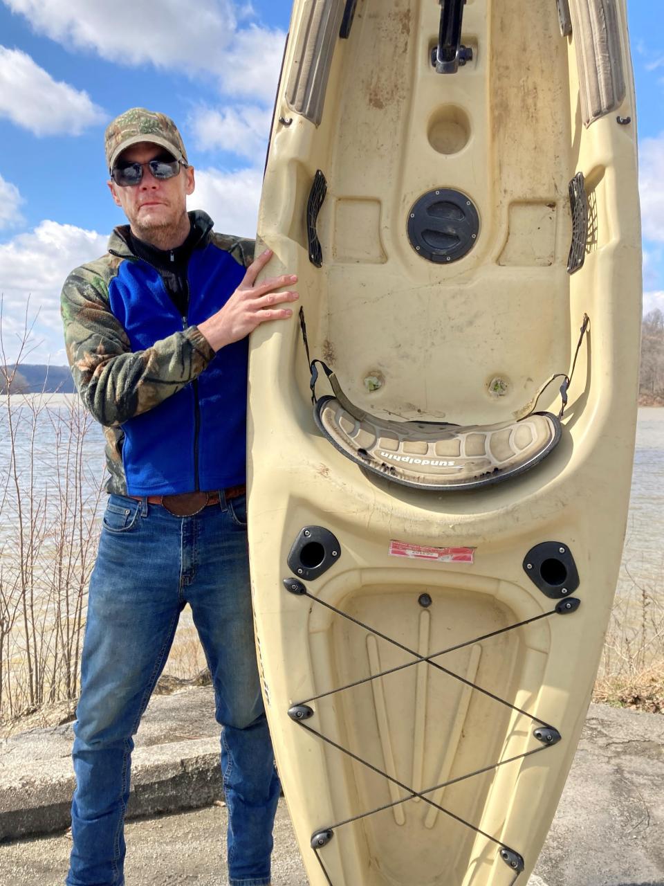 West Muskingum High School alum James Clark stands with a kayak at Dillon State Park. He is the creator of the nonprofit organization Kombat to Kayaks that will provide veterans with outdoor activities, such as kayaking, fishing and hiking