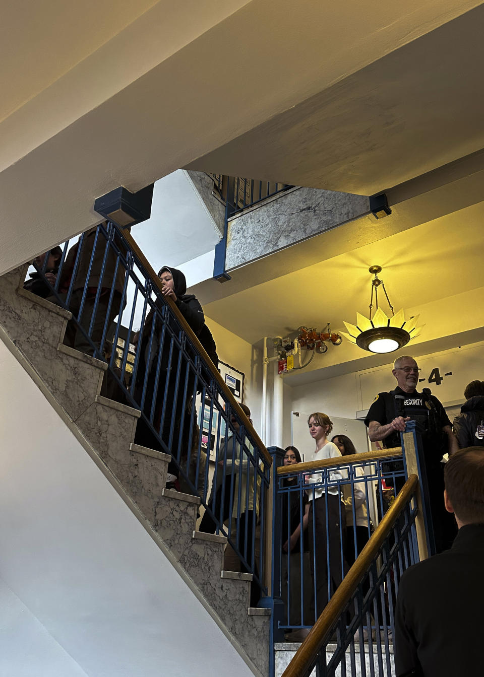 Students walk up the stairs at the state Capitol on Thursday, April 4, 2024, in Juneau, Alaska. Students from Juneau-Douglas High School: Yadaa.at Kalé marched to the Capitol as part of an walkout to protest Republican Gov. Mike Dunleavy's veto of an education package last month and the Legislature's failure to override that veto. (AP Photo/Becky Bohrer)